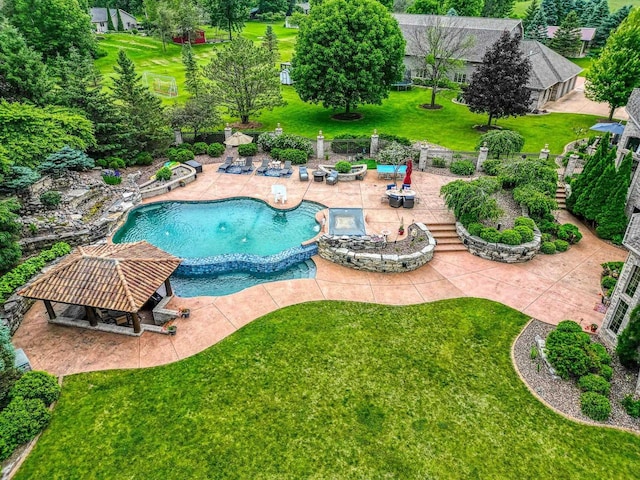 W1977 Center Valley Rd, Kaukauna, WI 54130 - view of swimming pool featuring a patio area, a lawn, and a pool with connected hot tub