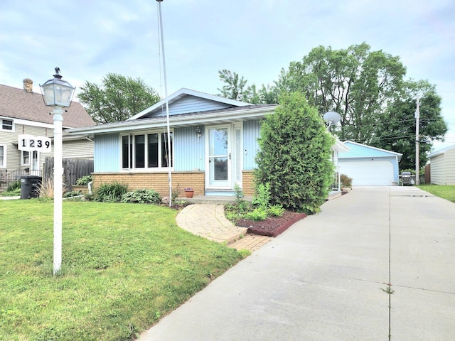1239 Columbus Ave, Sheboygan, WI 53083 - view of front facade featuring a garage, brick siding, and an outdoor structure