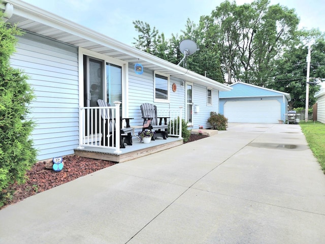 1239 Columbus Ave, Sheboygan, WI 53083 - view of front facade featuring a detached garage and an outbuilding