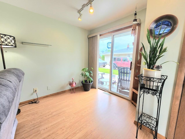 1239 Columbus Ave, Sheboygan, WI 53083 - living area featuring wood finished floors and rail lighting