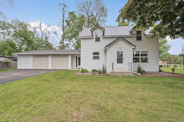 243 Chicago St, Pulaski, WI 54162 - traditional-style home with driveway, a garage, and a front yard