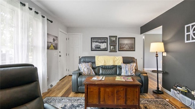 12901 7th St, Osseo, WI 54758 - living area featuring wood finished floors and baseboards