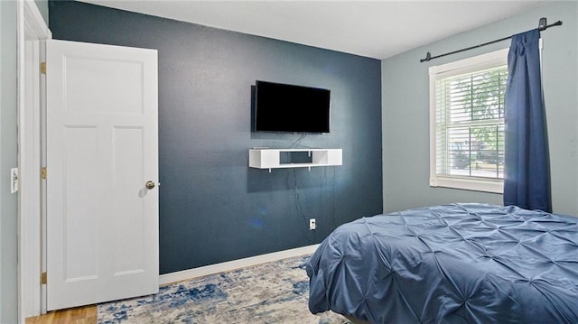 12901 7th St, Osseo, WI 54758 - bedroom featuring wood finished floors and baseboards