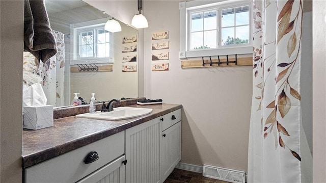 12901 7th St, Osseo, WI 54758 - full bathroom featuring healthy amount of natural light, vanity, and a shower with shower curtain