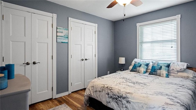 12901 7th St, Osseo, WI 54758 - bedroom featuring multiple closets, wood finished floors, and ceiling fan