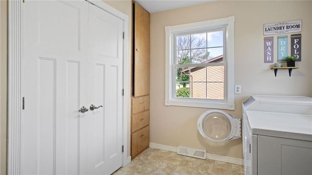 12901 7th St, Osseo, WI 54758 - laundry room with washer and dryer and baseboards
