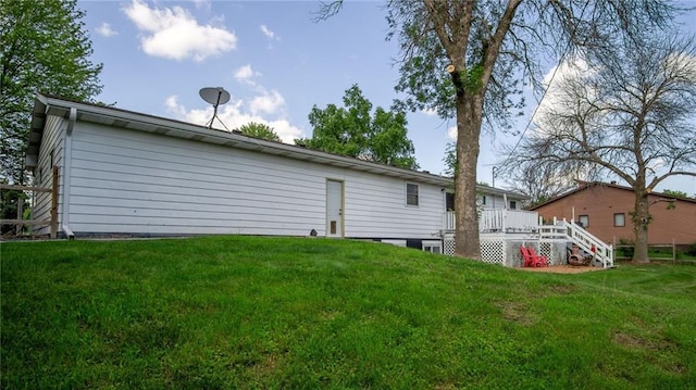 12901 7th St, Osseo, WI 54758 - rear view of property with a wooden deck and a lawn