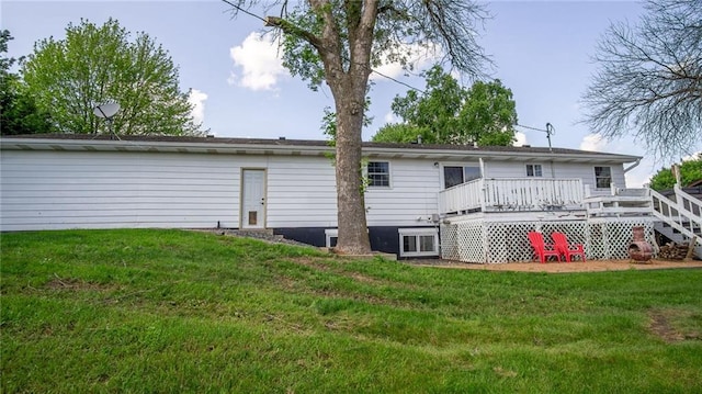 12901 7th St, Osseo, WI 54758 - rear view of house featuring a deck and a yard