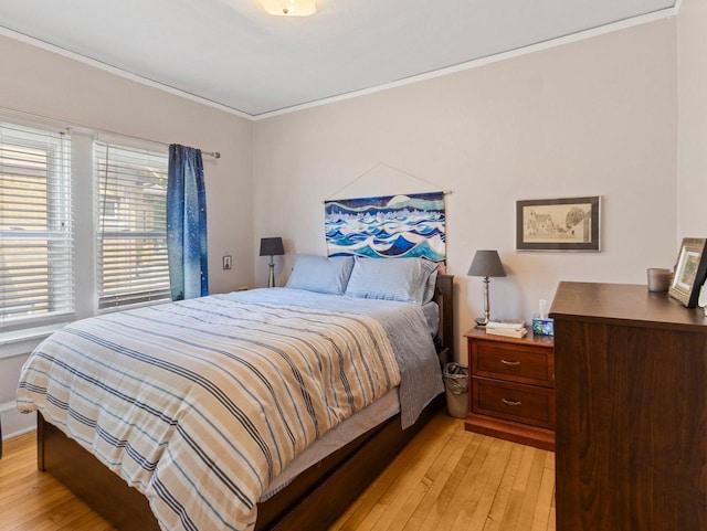 2221 N 60th St, Milwaukee, WI 53208 - bedroom with light wood-style floors and crown molding