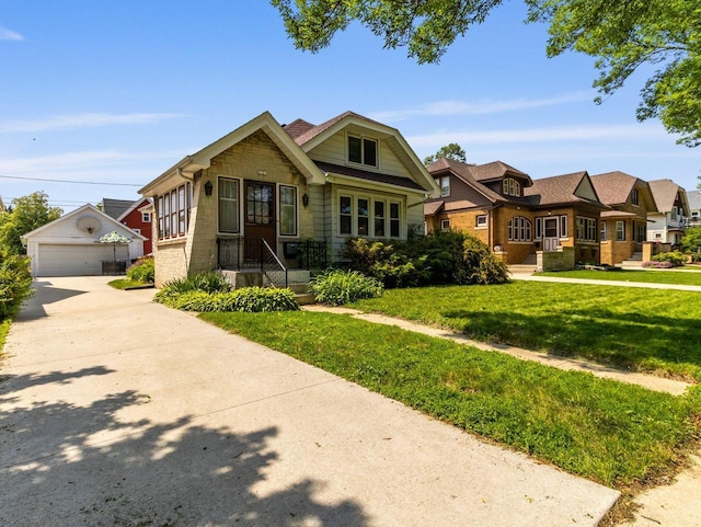 2221 N 60th St, Milwaukee, WI 53208 - view of front of house with an outbuilding, stone siding, a front lawn, and a garage