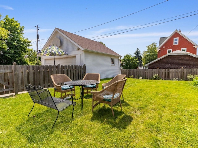 2221 N 60th St, Milwaukee, WI 53208 - fenced backyard with a detached garage and an outdoor structure