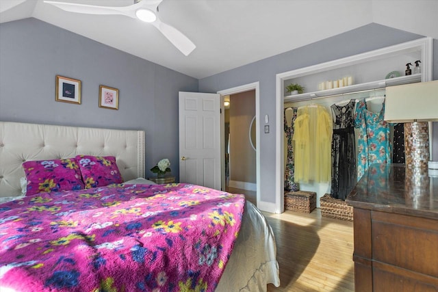 128 Maple Ave, Hartland, WI 53029 - bedroom with lofted ceiling, wood finished floors, a ceiling fan, and a closet