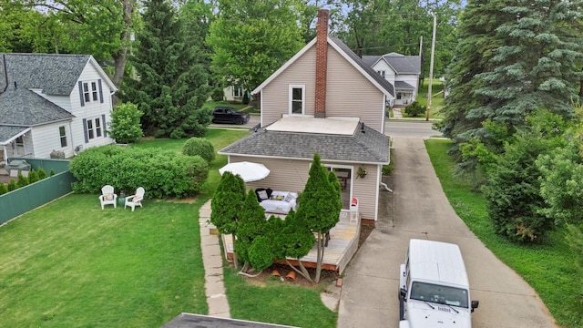 128 Maple Ave, Hartland, WI 53029 - view of property exterior with a chimney, roof with shingles, and a wooden deck