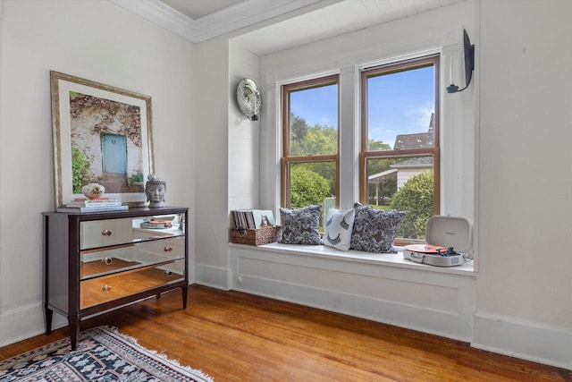 128 Maple Ave, Hartland, WI 53029 - sitting room featuring wood finished floors and ornamental molding