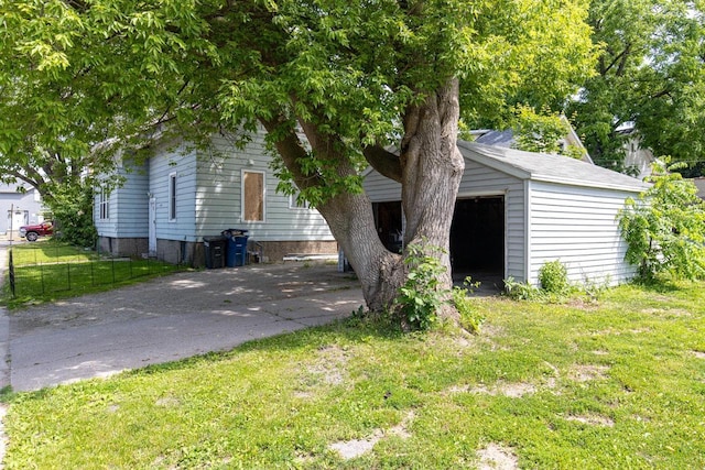 863 Jackson St, Oshkosh, WI 54901 - view of front of home with a garage, an outdoor structure, and driveway