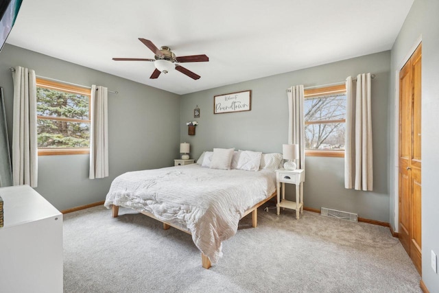3901 Western Way, Racine, WI 53404 - carpeted bedroom featuring multiple windows and ceiling fan
