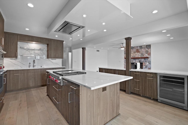 6834 S 35th St, Franklin, WI 53132 - kitchen with wine cooler, appliances with stainless steel finishes, a kitchen island, modern cabinets, and recessed lighting