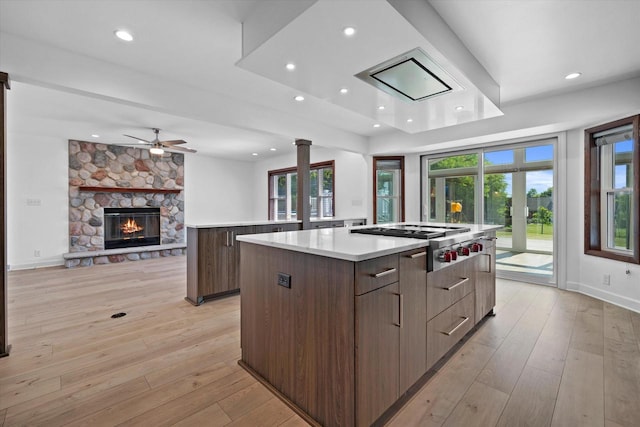 6834 S 35th St, Franklin, WI 53132 - kitchen featuring modern cabinets, stainless steel gas cooktop, a spacious island, healthy amount of natural light, and recessed lighting