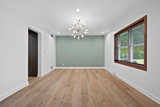 6834 S 35th St, Franklin, WI 53132 - empty room with a chandelier, recessed lighting, and light wood finished floors