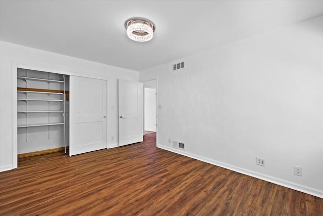6834 S 35th St, Franklin, WI 53132 - unfurnished bedroom with wood finished floors and a closet