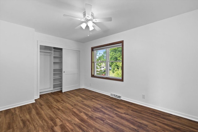 6834 S 35th St, Franklin, WI 53132 - unfurnished bedroom with dark wood-style floors, a closet, and ceiling fan