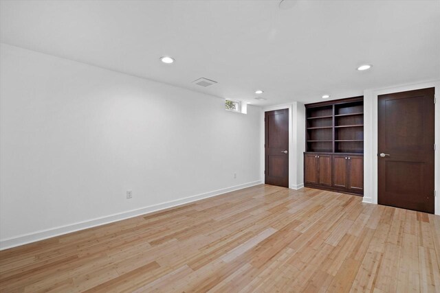 6834 S 35th St, Franklin, WI 53132 - spare room with light wood finished floors, recessed lighting, and built in features