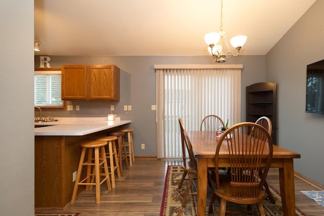 123 Westgate Dr, Iron Ridge, WI 53035 - dining room featuring a chandelier, wood finished floors, and lofted ceiling