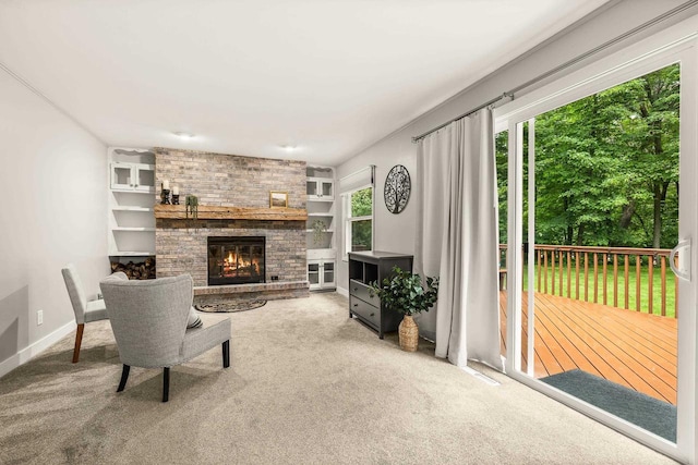 2311 Maplewood Dr, Plover, WI 54467 - living room with carpet floors and a brick fireplace