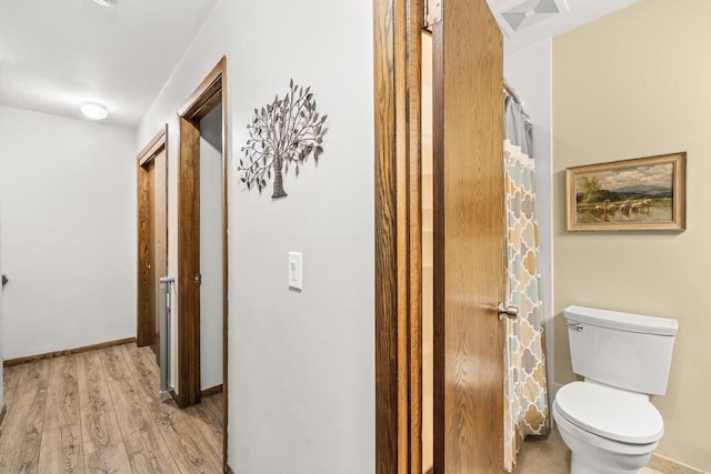2311 Maplewood Dr, Plover, WI 54467 - bathroom with wood finished floors and toilet