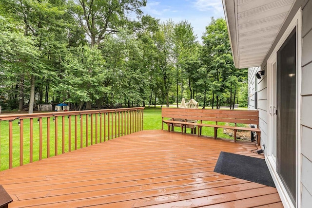 2311 Maplewood Dr, Plover, WI 54467 - deck featuring view of wooded area and a yard