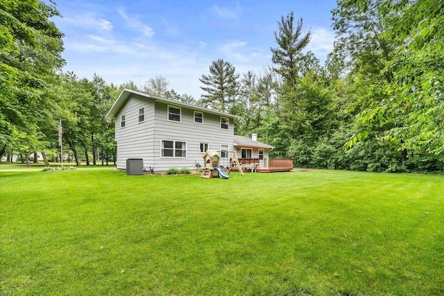2311 Maplewood Dr, Plover, WI 54467 - back of house with a lawn and a wooden deck