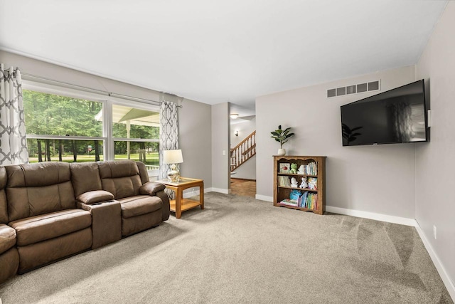 2311 Maplewood Dr, Plover, WI 54467 - living area featuring carpet floors and stairs