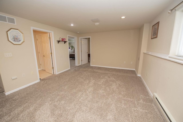 708 Owl Ln, Stevens Point, WI 54482 - empty room with baseboard heating, light colored carpet, and recessed lighting