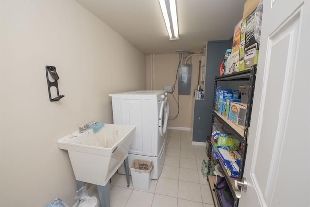 708 Owl Ln, Stevens Point, WI 54482 - washroom with electric panel, washer and dryer, and light tile patterned floors