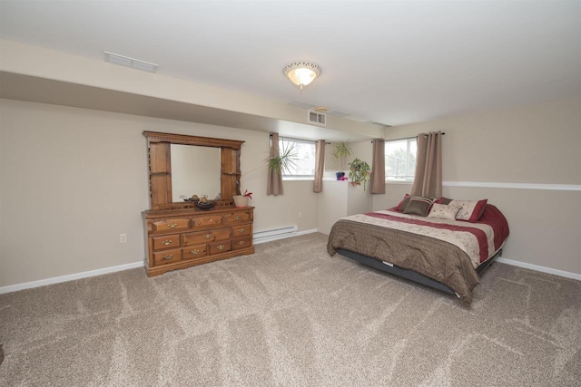 708 Owl Ln, Stevens Point, WI 54482 - carpeted bedroom with a baseboard heating unit and baseboards