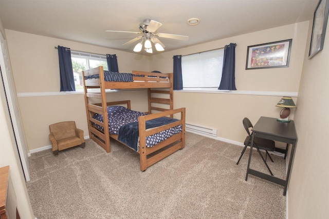 708 Owl Ln, Stevens Point, WI 54482 - carpeted bedroom with a baseboard heating unit and baseboards