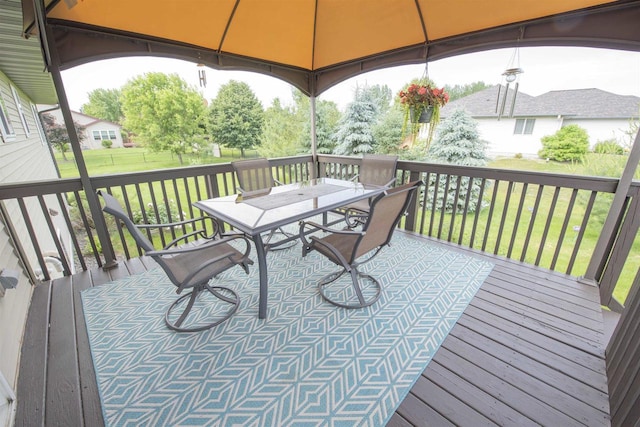 708 Owl Ln, Stevens Point, WI 54482 - wooden deck featuring a gazebo, outdoor dining space, and a yard
