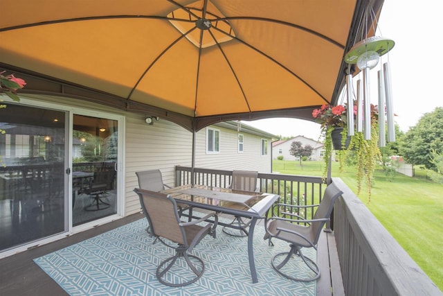 708 Owl Ln, Stevens Point, WI 54482 - wooden deck featuring a gazebo, a yard, and outdoor dining space