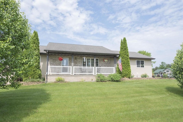 708 Owl Ln, Stevens Point, WI 54482 - single story home featuring a front lawn, covered porch, and brick siding