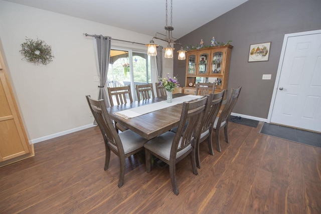 708 Owl Ln, Stevens Point, WI 54482 - dining area with vaulted ceiling and dark wood-style floors