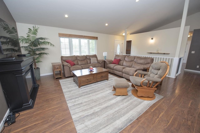708 Owl Ln, Stevens Point, WI 54482 - living area featuring wood finished floors, lofted ceiling, and recessed lighting
