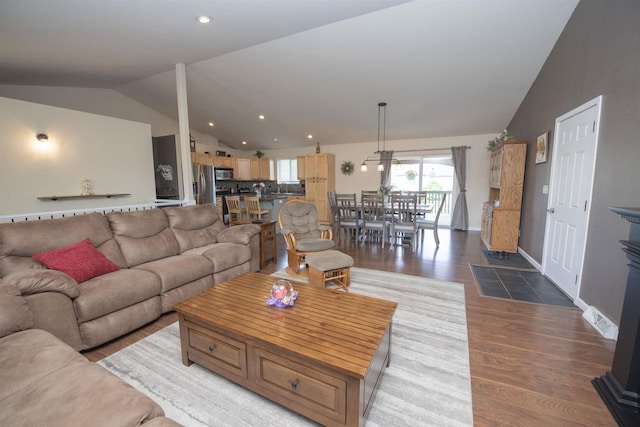 708 Owl Ln, Stevens Point, WI 54482 - living room featuring vaulted ceiling, wood finished floors, and recessed lighting