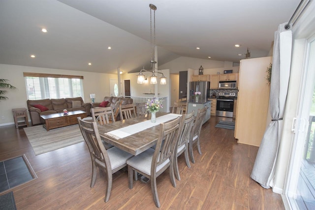 708 Owl Ln, Stevens Point, WI 54482 - dining space with vaulted ceiling, dark wood finished floors, and recessed lighting