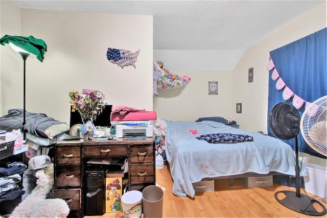 1208 Wisconsin St, Stevens Point, WI 54481 - bedroom featuring wood finished floors and vaulted ceiling