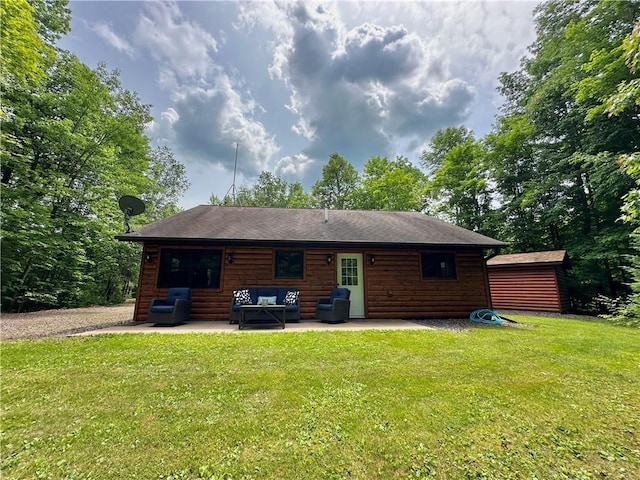 4686 W Butler Rd, Winter, WI 54896 - back of property with an outdoor hangout area, log veneer siding, a patio, and a lawn