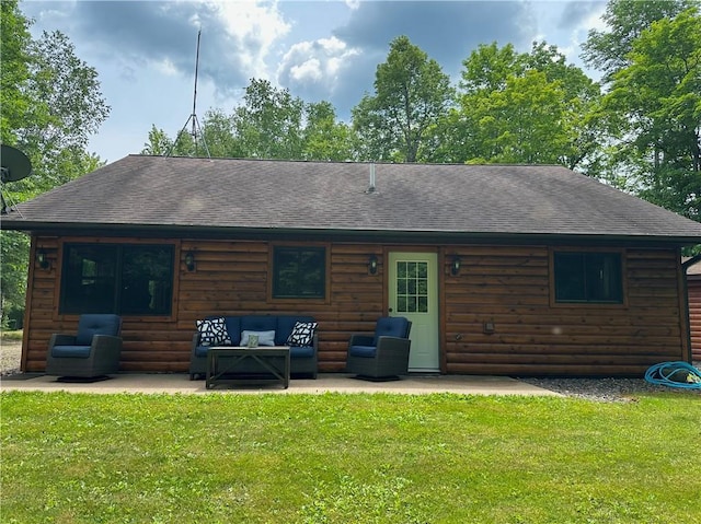 4686 W Butler Rd, Winter, WI 54896 - rear view of property featuring faux log siding, an outdoor living space, and roof with shingles
