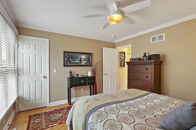 413 56th St, Kenosha, WI 53140 - bedroom featuring light wood-type flooring, ornamental molding, and ceiling fan