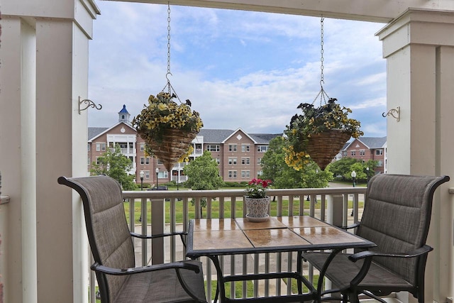 413 56th St, Kenosha, WI 53140 - balcony featuring outdoor dining space and a residential view