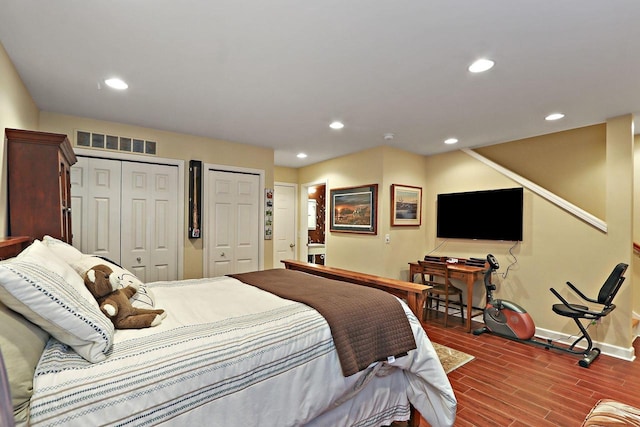 413 56th St, Kenosha, WI 53140 - bedroom featuring two closets, recessed lighting, and wood finished floors
