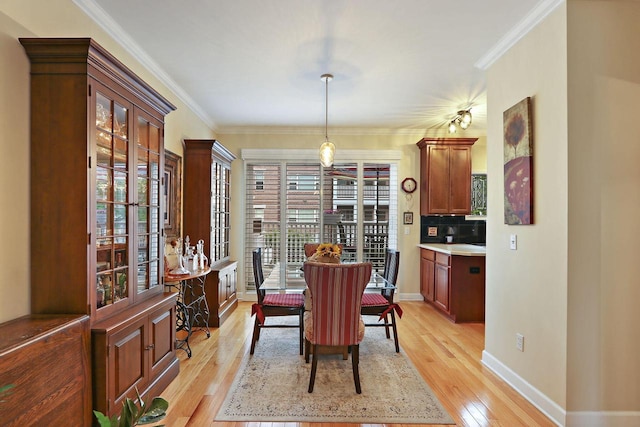 413 56th St, Kenosha, WI 53140 - dining room with light wood-type flooring and ornamental molding